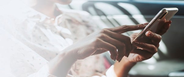 woman-using-a-phone-in-a-car